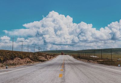 Road on field against sky