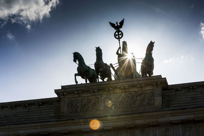 Low angle view of statue against sky