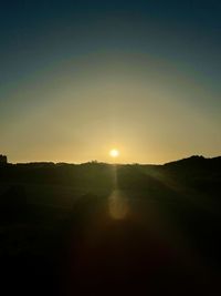 Scenic view of silhouette landscape against sky during sunset