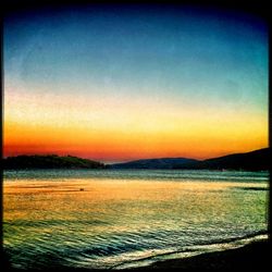 Scenic view of sea at sunset