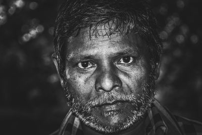 Close-up portrait of serious man outdoors