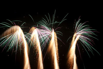 Close-up of firework display against sky at night