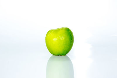 Close-up of apple against white background