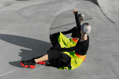 High angle view of woman reflecting on mirror