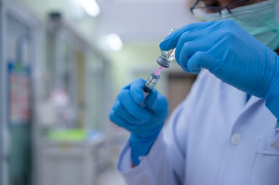 Close-up of hand holding umbrella