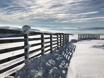 Scenic view of snowcapped mountains against sky during winter