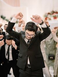 Groomsmen have fun dancing at the wedding party