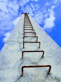 Low angle view of ladder against sky