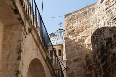 Low angle view of old building against clear sky