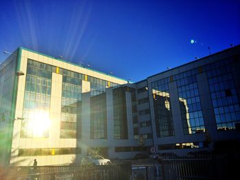 Low angle view of buildings against blue sky