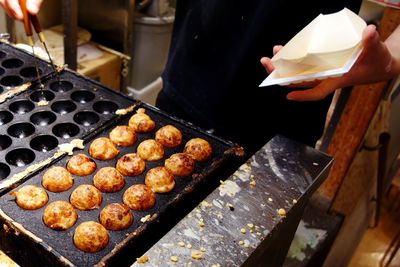 Close-up of takoyaki making