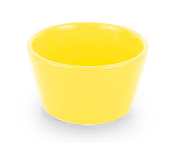 High angle view of yellow drink against white background
