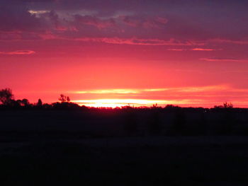 Scenic view of silhouette landscape against sky during sunset