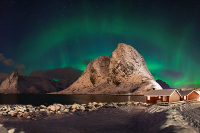 Scenic view of rock against sky at night