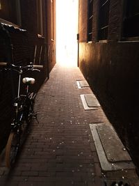 Footpath amidst buildings in city