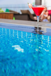 Close-up of drink in swimming pool