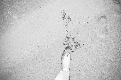 Cropped image of person standing on tiled floor