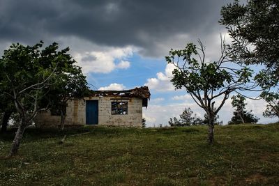 House on field against sky