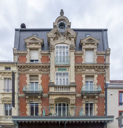 Low angle view of residential building against sky