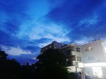 Low angle view of building against blue sky