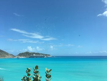 Scenic view of sea against blue sky