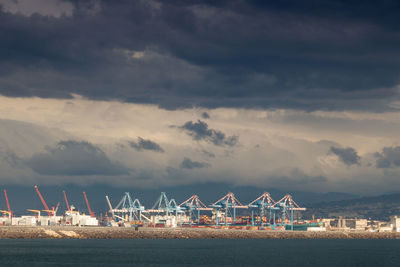 Cranes in the port of naples on a stormy day