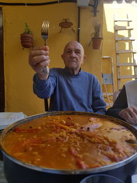 Midsection of man preparing food