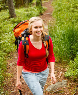 Portrait of young woman smiling in forest
