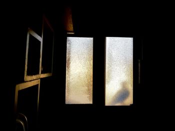 Close-up of window in dark room