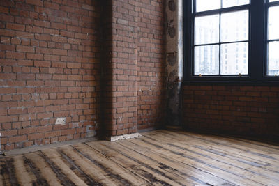 View of wooden floor against wall