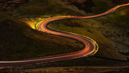 High angle view of light trails on road