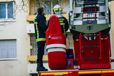 Rear view of man working