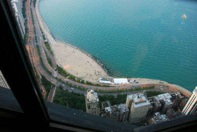 High angle view of sea seen through window