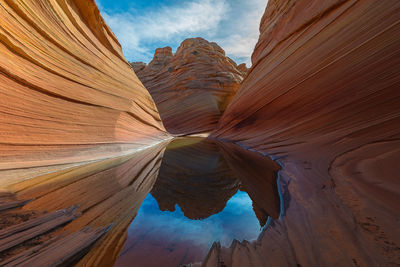 Low angle view of rock formations against sky