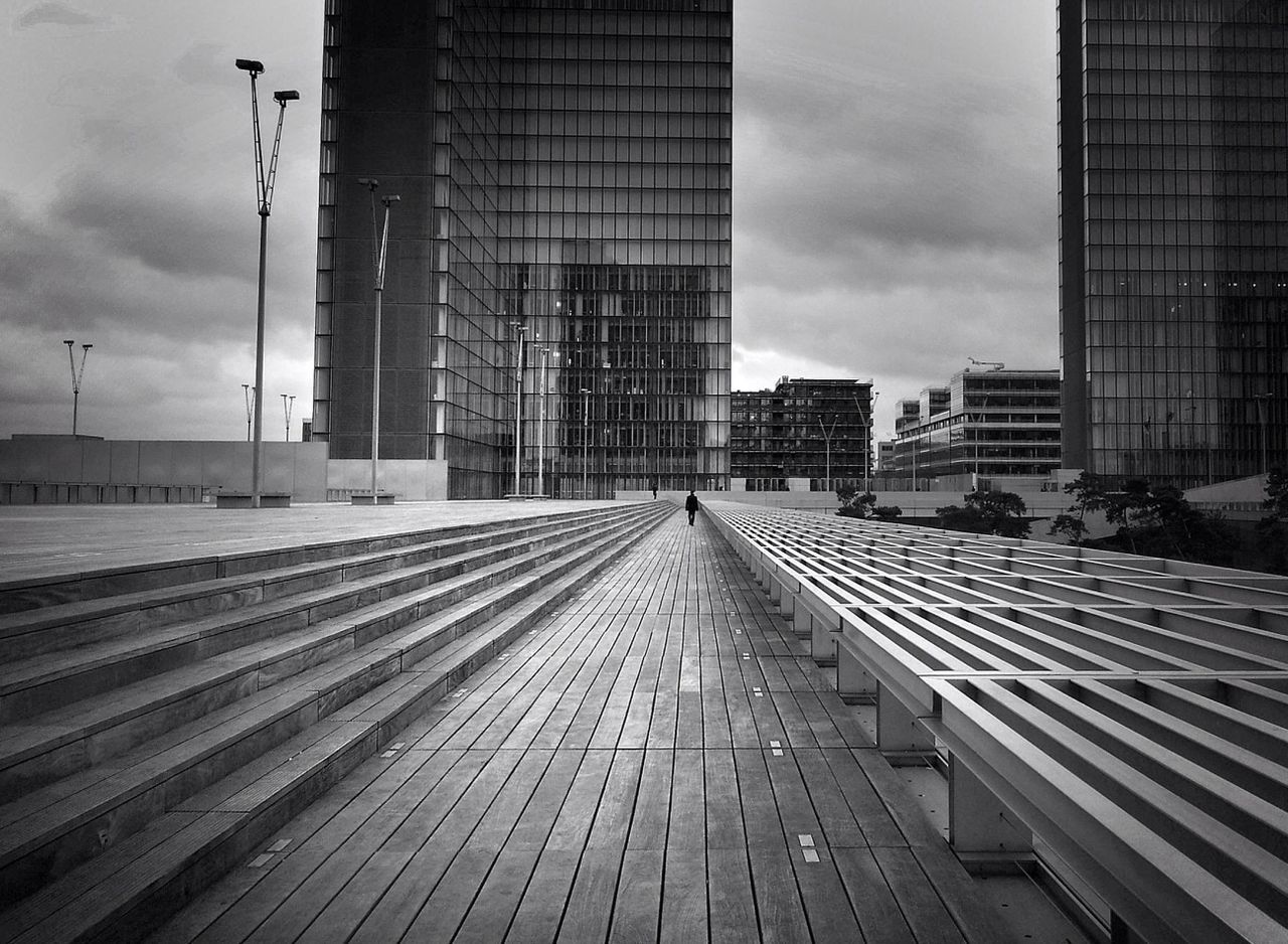 building exterior, architecture, built structure, sky, city, the way forward, cloud - sky, diminishing perspective, building, vanishing point, modern, cloudy, weather, office building, day, skyscraper, outdoors, street, cloud, city life