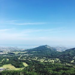 Scenic view of landscape against blue sky