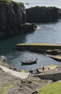 High angle view of people standing at beach