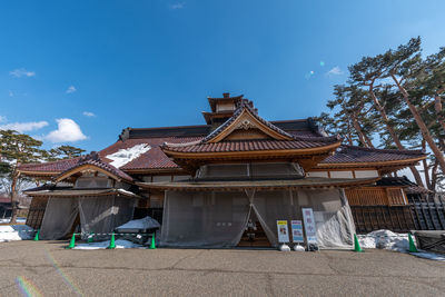 Low angle view of building against blue sky