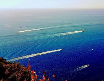 Aerial view of sea and landscape against sky