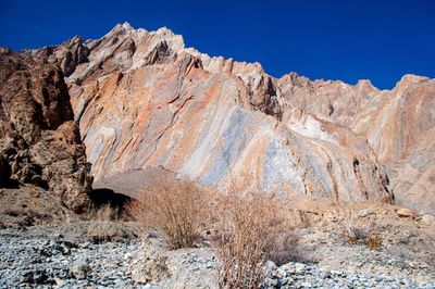 Scenic view of mountains against clear blue sky