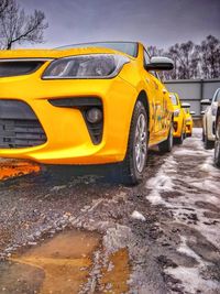 Yellow car on road in city