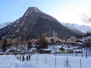 Scenic view of snow covered mountains against sky