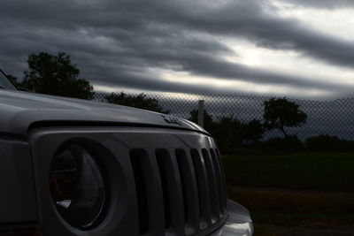 Close-up of car against sky