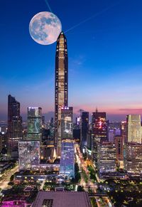 Illuminated buildings in city at night