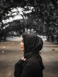 Portrait of man standing in snow