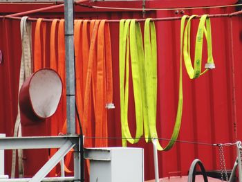 Close-up of multi colored  water hoses in row  at the fire department. 