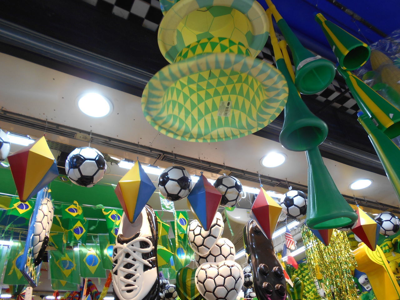 LOW ANGLE VIEW OF ILLUMINATED LANTERNS HANGING AT NIGHT