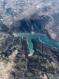 Aerial view of lake amidst mountains