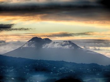 Scenic view of mountains against sky during sunset
