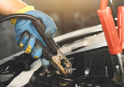 Close-up of man working at machine